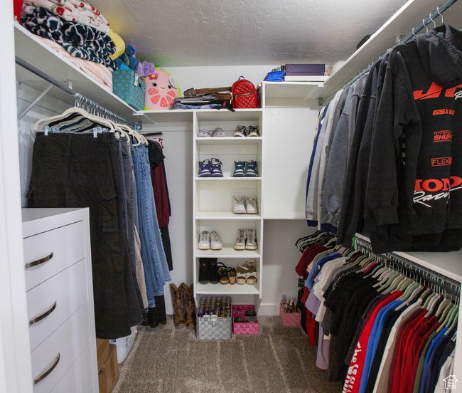 Walk in closet featuring carpet flooring | Image 9