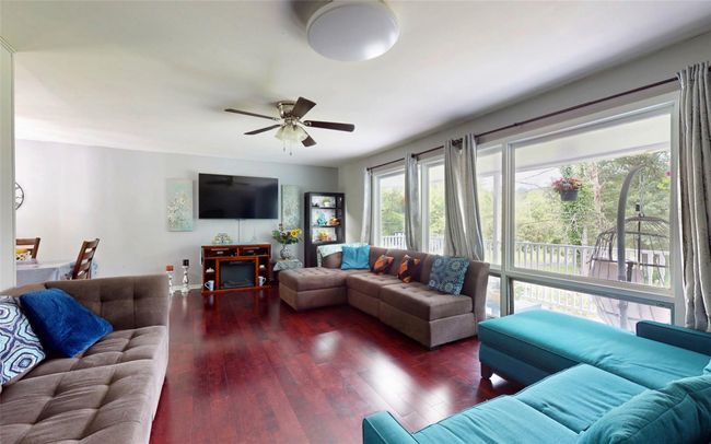 Living area with hardwood / wood-style flooring and ceiling fan | Image 14