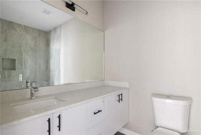 Bathroom featuring vanity and toilet | Image 5