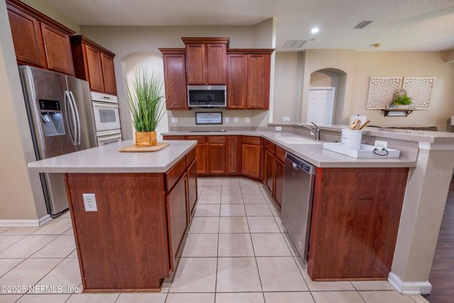 11760 Huckleberry Trl E, House other with 4 bedrooms, 2 bathrooms and null parking in MACCLENNY FL | Image 10