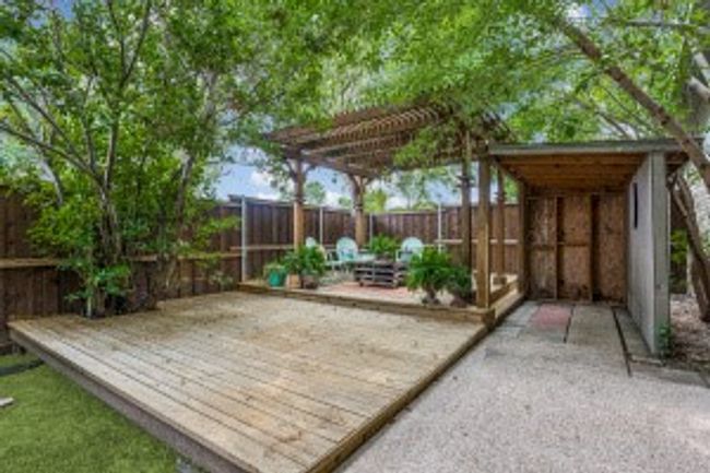 Wooden deck featuring a fenced backyard | Image 24