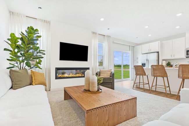 (Photo of decorated model, actual home's finishes will vary) Another view of the great room. | Image 7