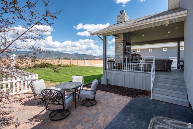 View of patio with outdoor dining space and a deck with mountain view | Image 92