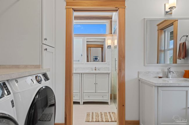 Half bathroom offers laundry. | Image 41