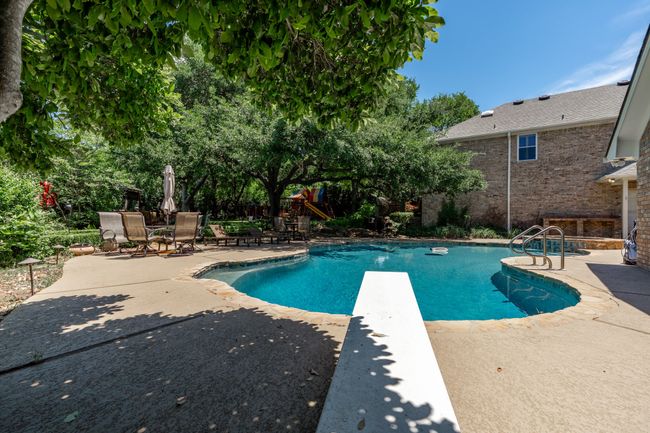 Heated, salt-water pool has diving board | Image 31