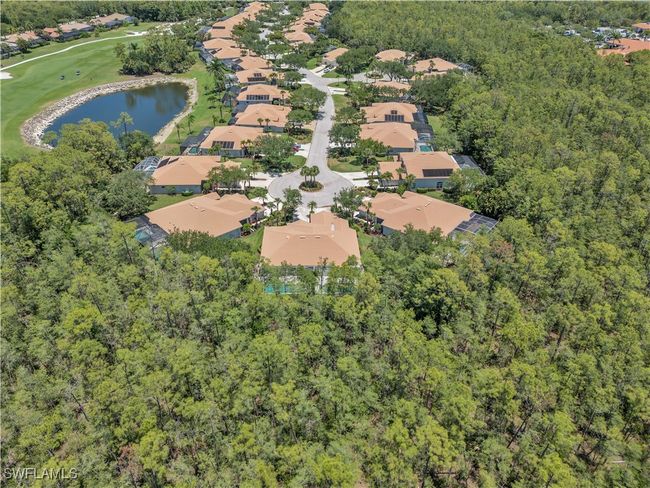Aerial view of property and surrounding area with nearby suburban area, a large body of water, a forest, and a golf course | Image 31