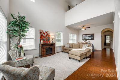 Open living space with 2-story ceilings | Image 2