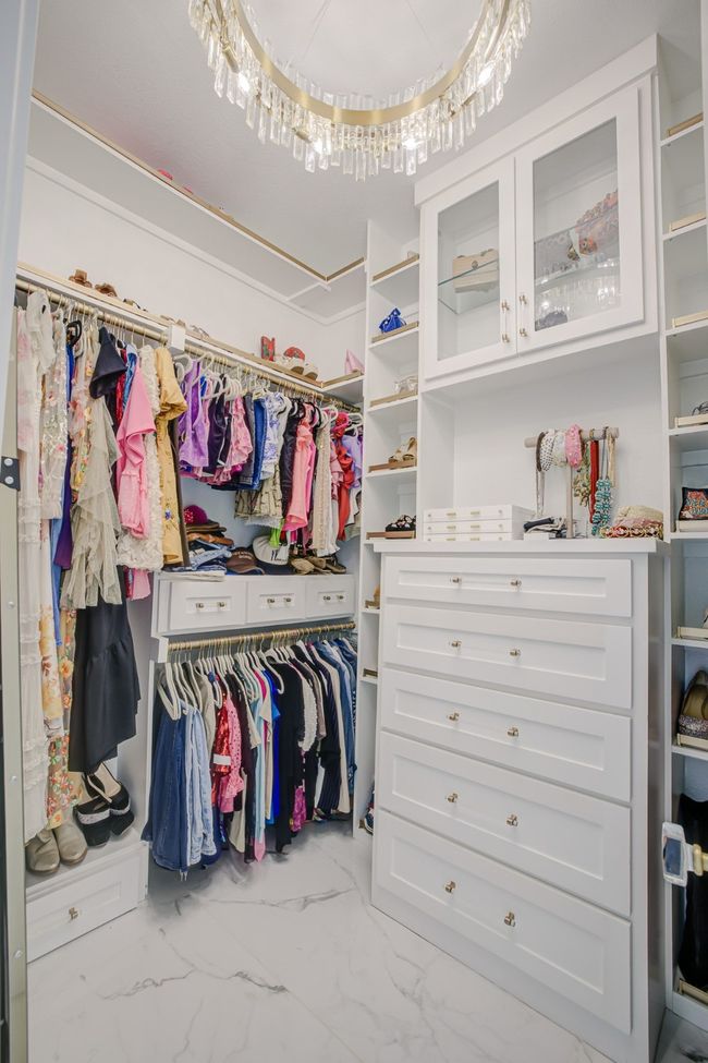 Spacious closet featuring marble finish floor | Image 18