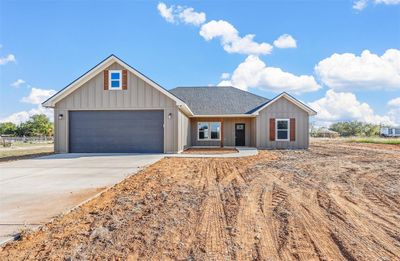 Ranch-style house with a garage | Image 1