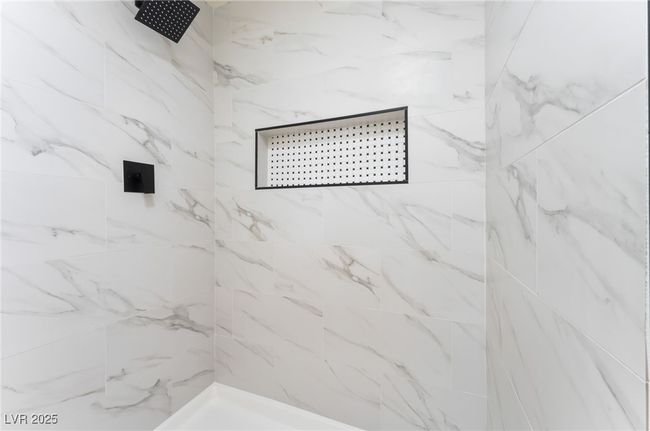Bathroom with a marble finish shower | Image 11