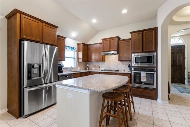 Stainless appliances & great island. | Image 9