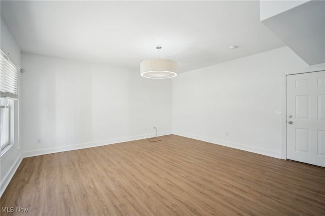 Unfurnished room with wood finished floors and baseboards | Image 28