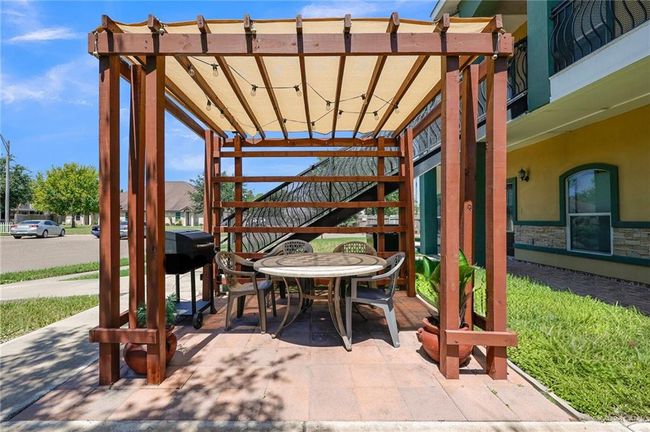 View of patio with a pergola | Image 11