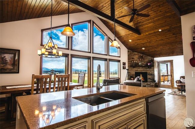 Kitchen is open to the living area so that you can socialize while you cook | Image 16