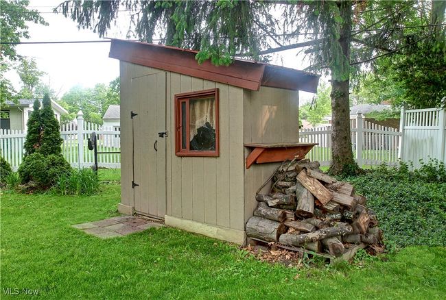 View of shed featuring a fenced backyard | Image 41