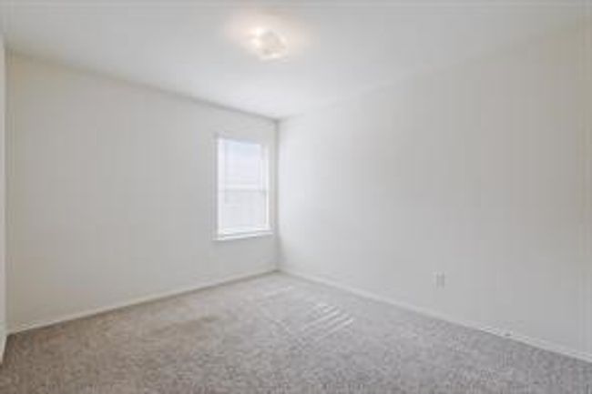 Carpeted spare room featuring baseboards | Image 12