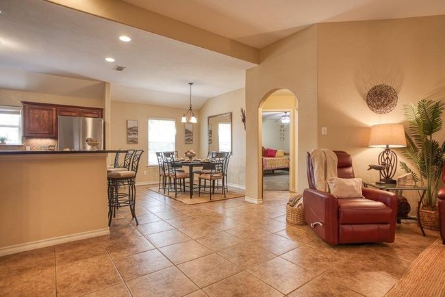 Arched ways lead to separate bedrooms and main bath | Image 25