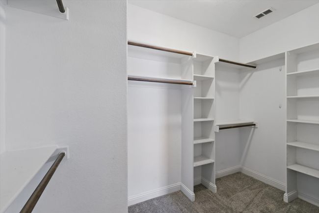 Walk in closet featuring carpet flooring | Image 22