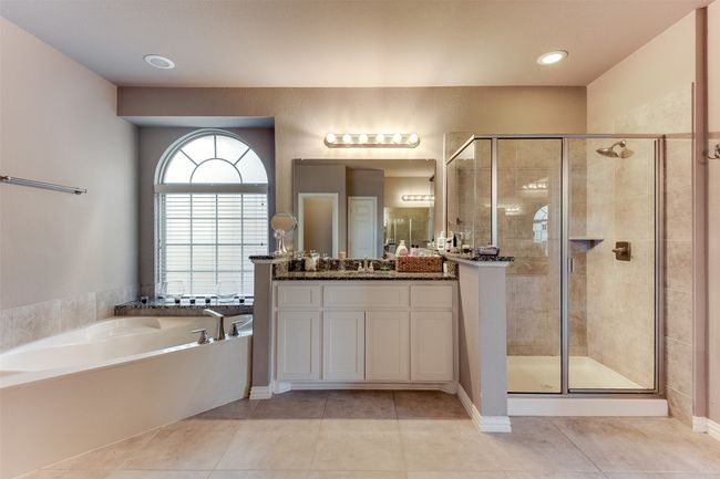 Bathroom featuring separate shower and tub, tile patterned flooring, and vanity | Image 29