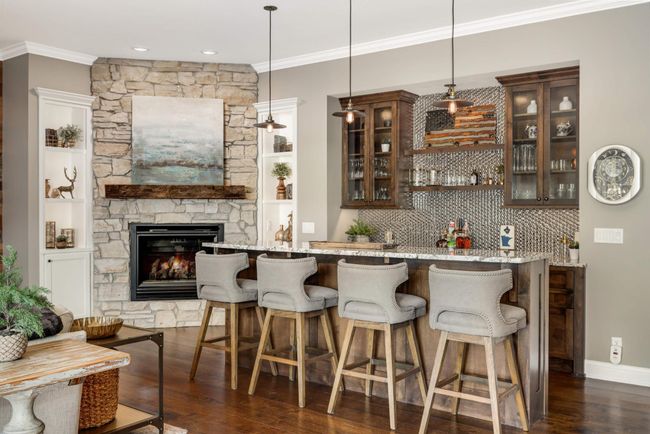 Family room has a full bar and fire place | Image 20