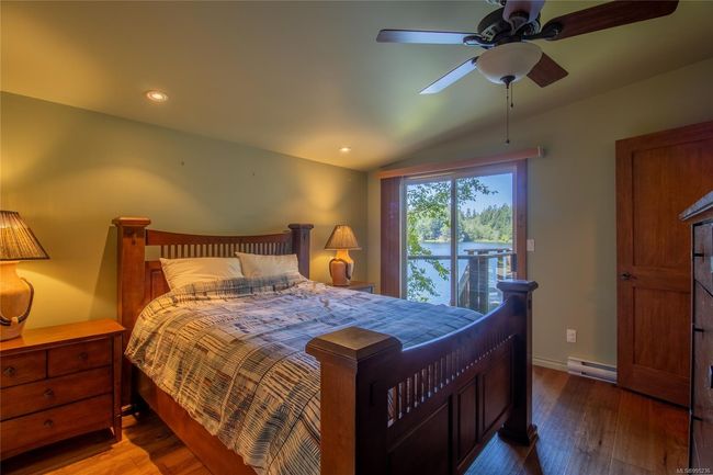 primary Bedroom with Lake view and access to the deck | Image 19
