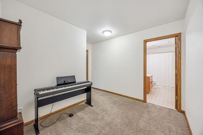 Lower level hallway to bath. | Image 27