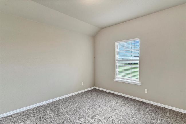 Empty room featuring vaulted ceiling and carpet | Image 26