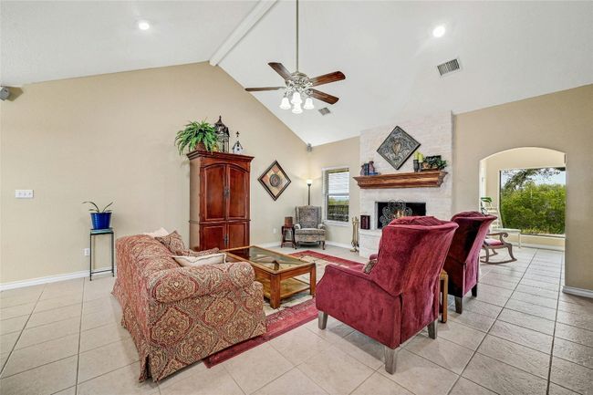 Living room is open to both views of the front and back of property. | Image 7