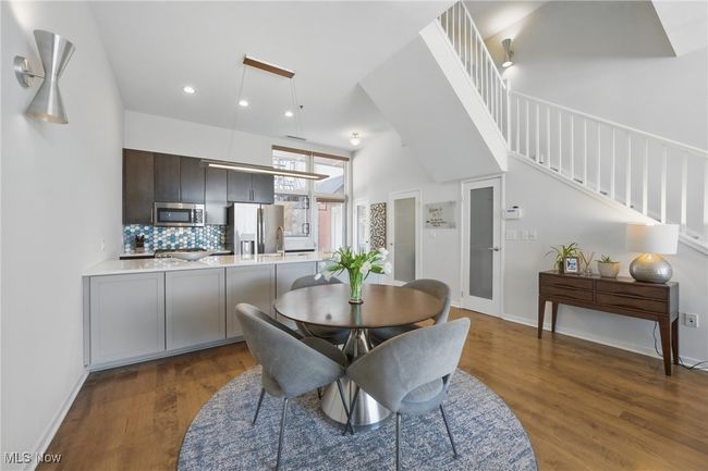 Dining area with baseboards, recessed lighting, stairway, and dark wood-style flooring | Image 10