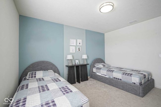 bedroom featuring carpet floors, baseboards, and visible vents | Image 26
