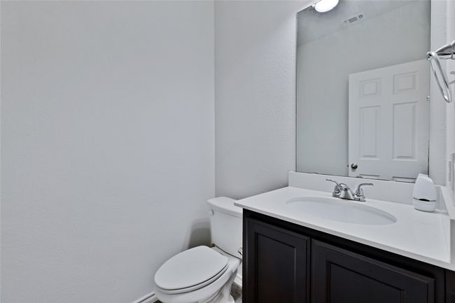 Half bathroom with vanity and toilet | Image 11