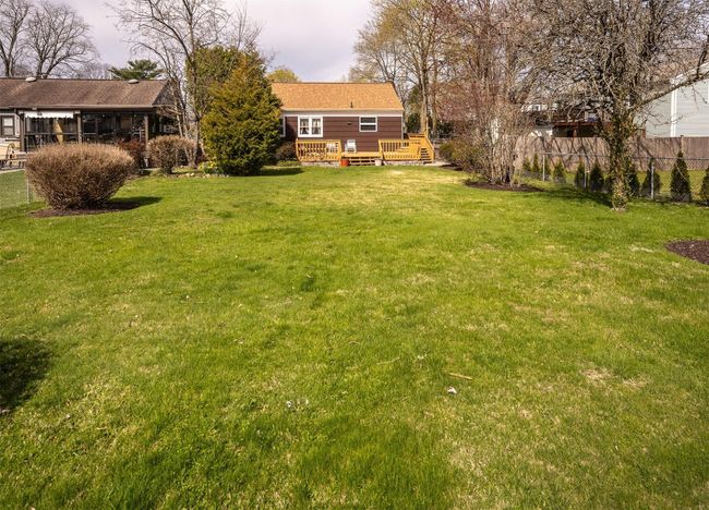 View of yard with deck and home | Image 18