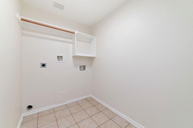 Well-designed utility room adjacent to three bedrooms, maximizing convenience and space. | Image 29