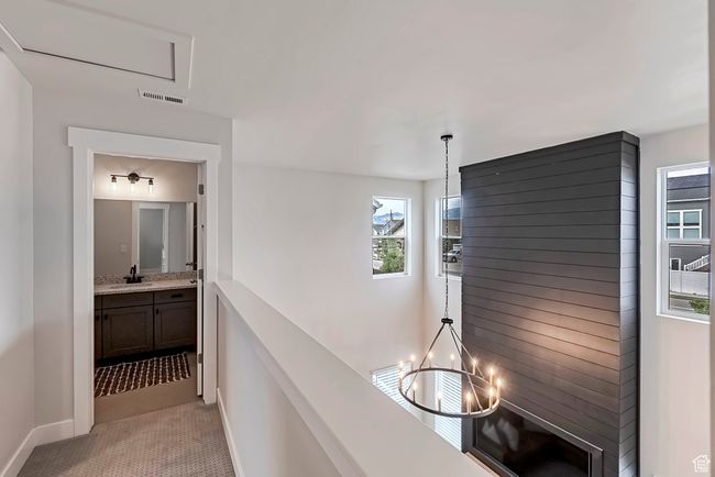 Hall featuring baseboards and light tile patterned floors | Image 22