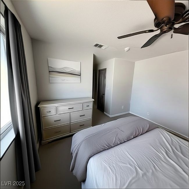 Bedroom featuring a ceiling fan and carpet flooring | Image 15