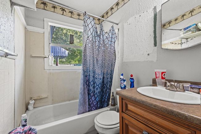 Full bathroom featuring vanity and shower / tub combo | Image 8