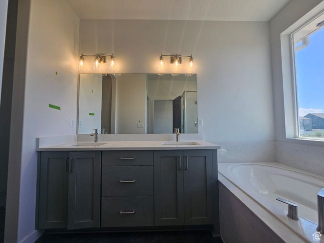 Full bathroom with double vanity, a garden tub, and a stall shower | Image 17
