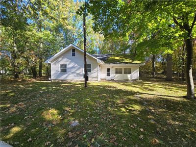 Rear view of house with a yard | Image 2