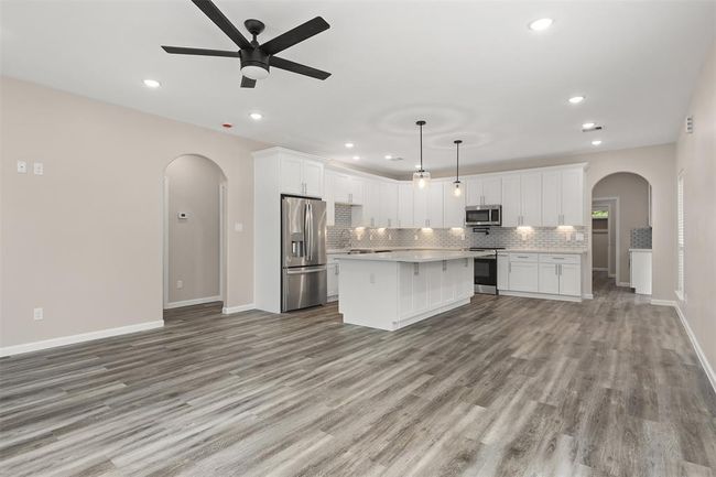 A second view of the living room and kitchen | Image 5