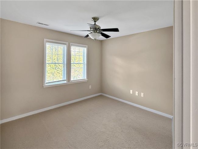 Empty room with carpet flooring and a ceiling fan | Image 14