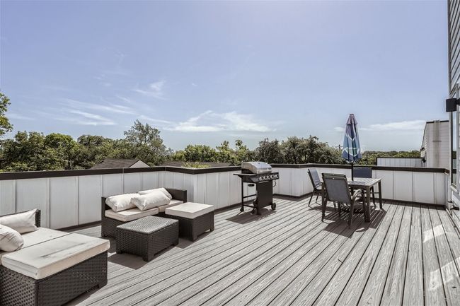 Enjoy the upstairs expansive private deck, ideal for outdoor entertaining. | Image 5