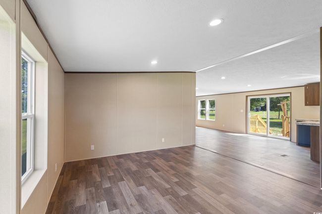 Unfurnished living room featuring wood finished floors and recessed lighting | Image 24