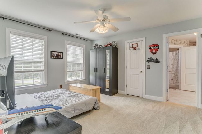 This bedroom shares J & J Bath | Image 58