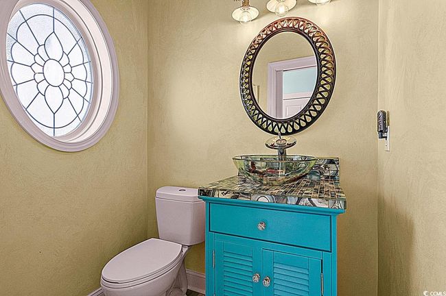 Bathroom with vanity, toilet, and baseboards | Image 8