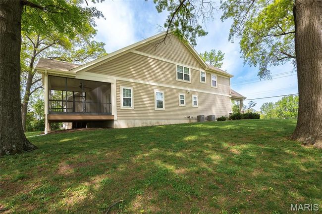Back of property featuring a yard and a screened in porch | Image 45