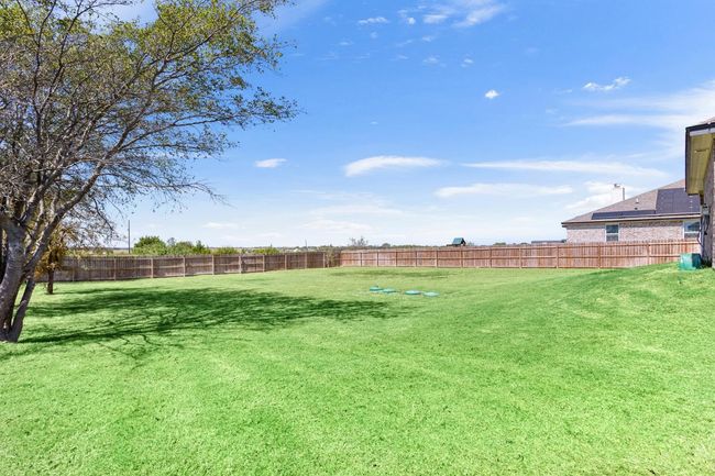 View of fenced backyard | Image 27