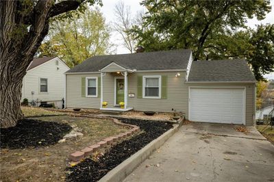 View of front of house featuring a garage | Image 1