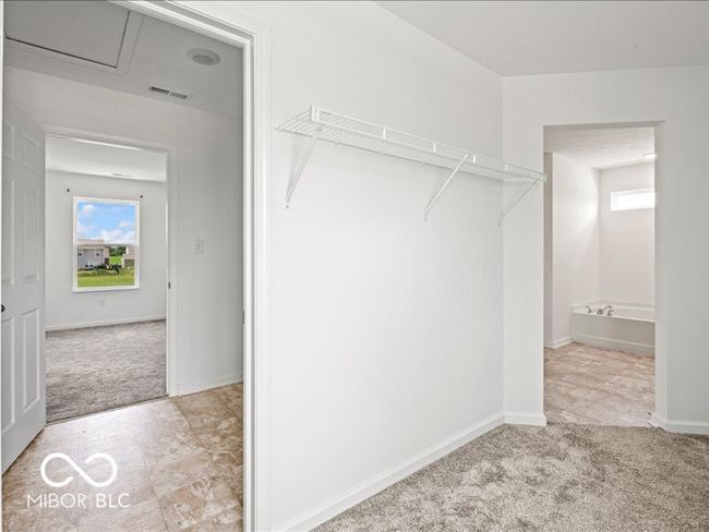 Walk-in closet is attached to the laundry room | Image 24