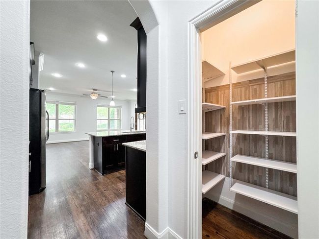 Alternate view of the mudroom offers a peek into the walk-in pantry—showcasing smart, seamless flow and functional design. | Image 20