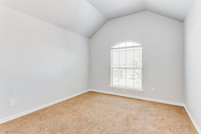Unfurnished room featuring carpet flooring and vaulted ceiling | Image 29